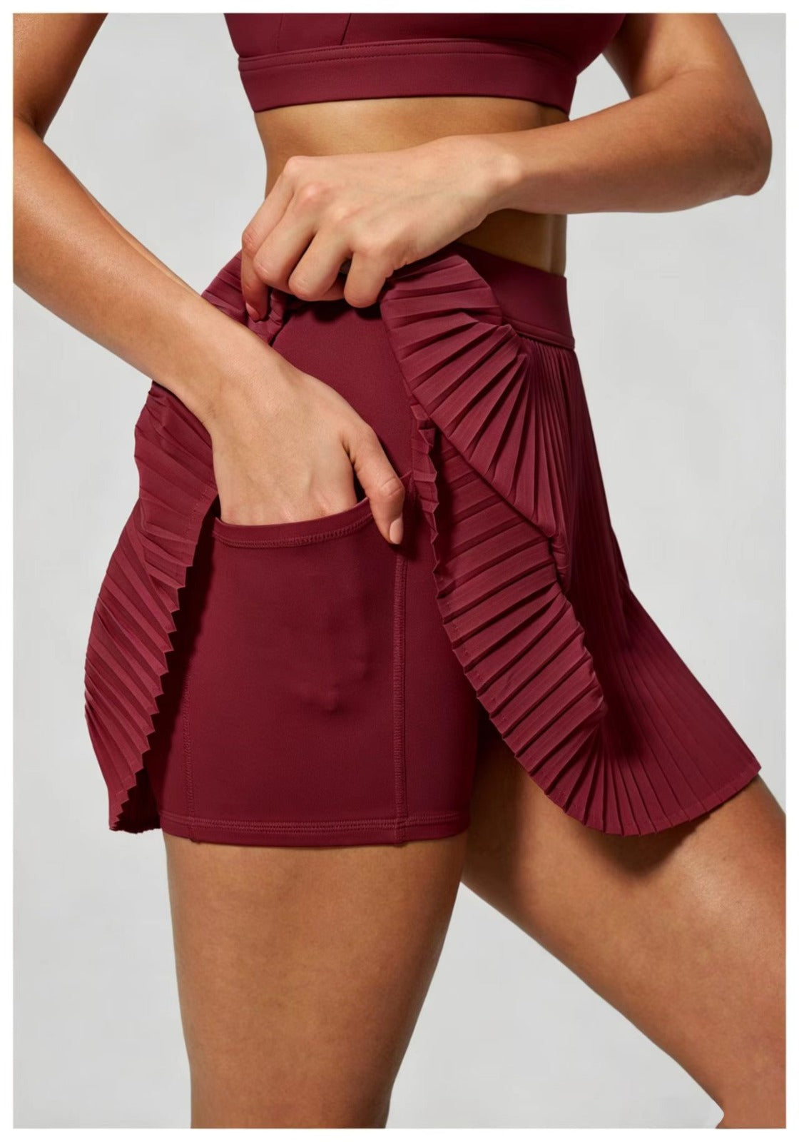 GRACE HIGH-WAISTED TENNIS SKORT | Crimson Red in - activewear